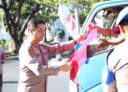 Kapolrestabes Makassar Bagikan Bendera Merah Putih Sambut HUT ke-80 RI